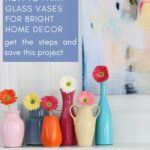 colored glass painted vases with zinnias on mantel