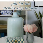 painted decorative box on table with flowers