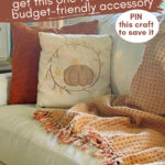 DIY pumpkin pillow on sofa with orange pillow